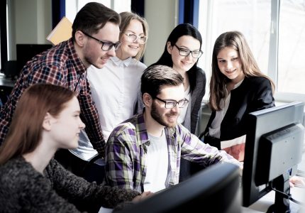 Group of students working on computers at university